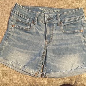 American Eagle light denim midi cut off shorts with super stretch size 4
